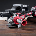 Worcraft brushless angle grinder with handle in use on wood planks