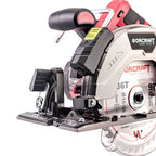 A close-up studio shot of a circular saw blade and baseplate assembly for a cordless circular saw, showing the silver carbide-lip blade, black and red handle components, and visible WORCRAFT branding on the housing.