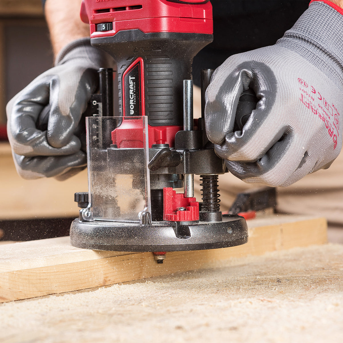 A person routing a piece of wood using a Worcraft brushless cordless router