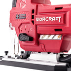 Close-up of a red Worcraft jigsaw with a silver base plate and black adjustment knobs, showing the brand name and blade settings on a white background.