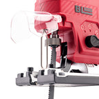 Close-up of a Worcraft red and black cordless jigsaw with a clear dust guard and metal guide rail, shown on a white background.