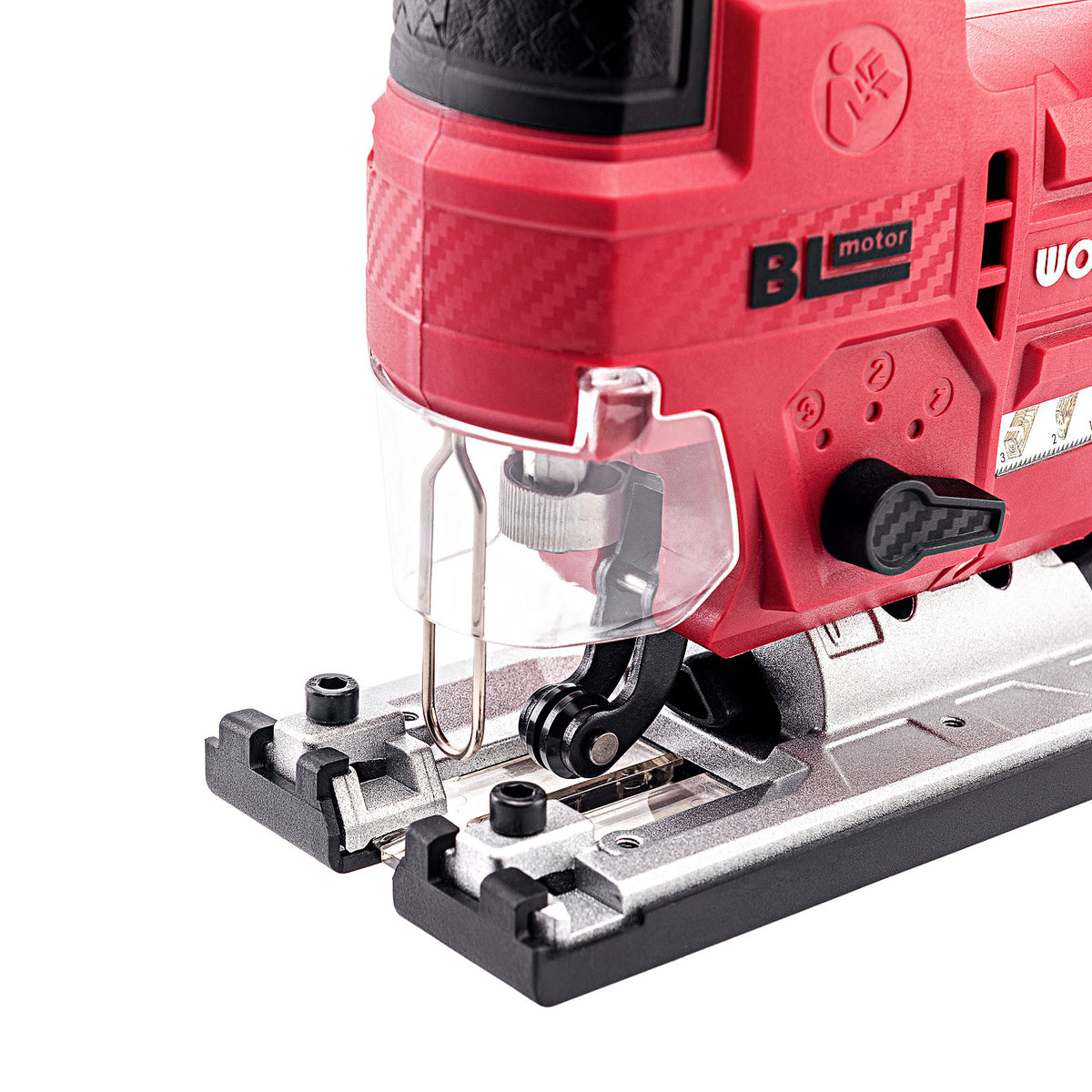 Close-up of a red and black Worcraft cordless jigsaw with a clear protective guard and silver metal base, shown on a white background.