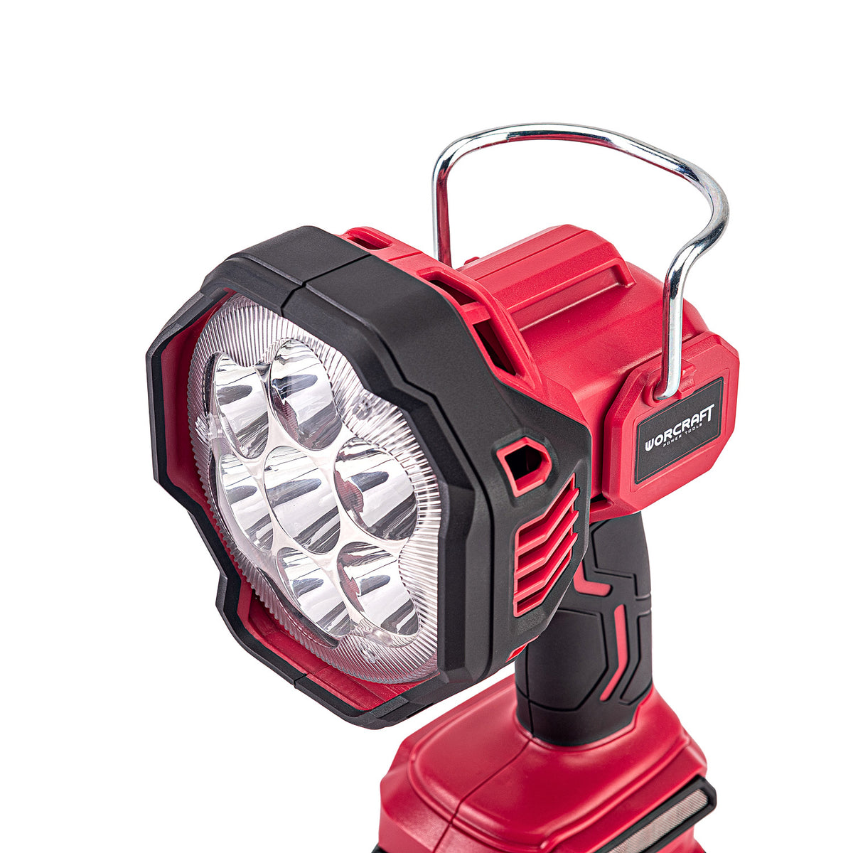 A red and black cordless work light with a silver metal handle, shown on a clean white background. The brand name 'WorCRAFT' is visible on the side of the housing.