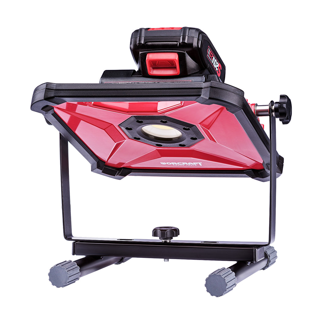 A red and black Worcraft brand led work light with a battery pack mounted on top, set against a solid white background.