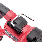 Close-up of a red and black cordless power tool showing a black plastic latch with a silver metal hook on top, photographed on a white background.