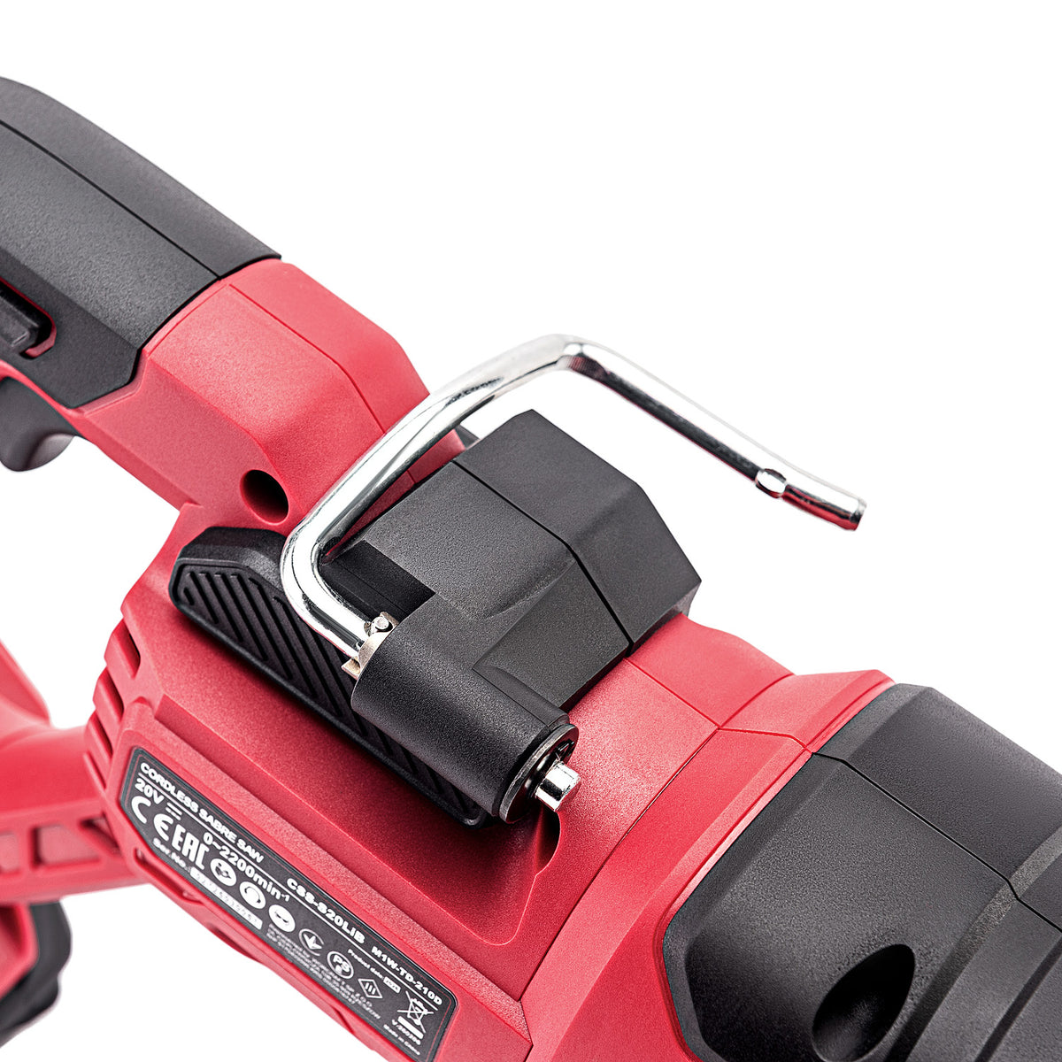 Close-up of a red and black cordless power tool showing a black plastic latch with a silver metal hook on top, photographed on a white background.