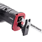 A close-up studio shot of a WORCRAFT reciprocating saw with a black and red handle, showing the blade attachment and part of the silver metal reciprocating blade on a white background.