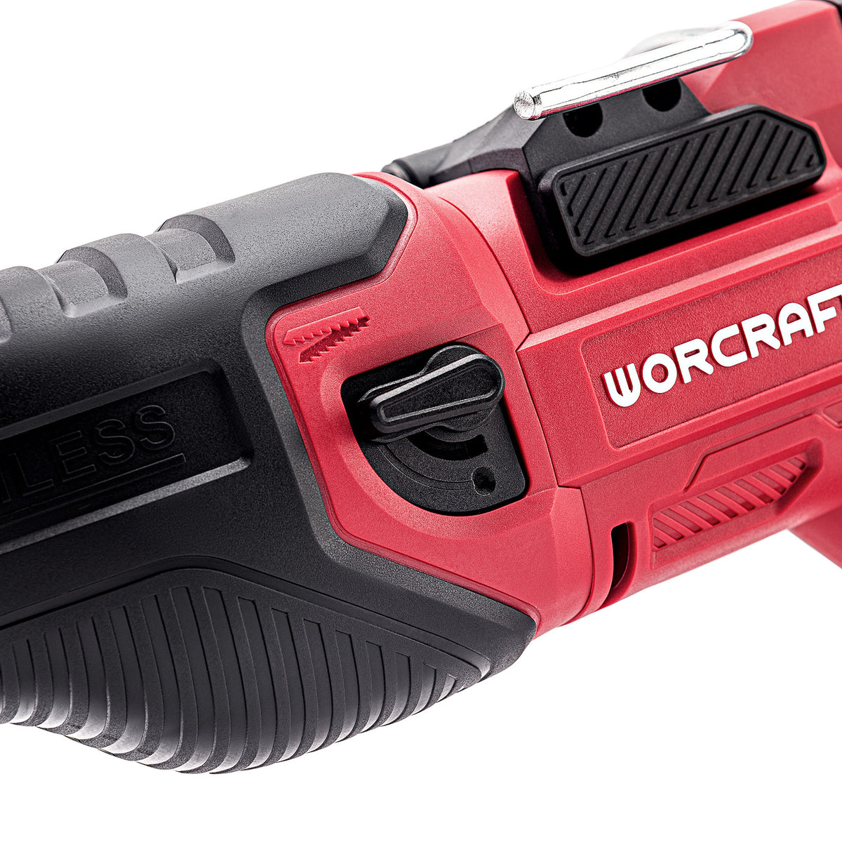 Close-up of a red and black WORCRAFT cordless tool showing the side switch, textured grip, and part of the brand name on a white background.