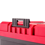 Close-up of a red plastic toolbox with a black handle latch on a white background.