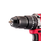 Close-up of a cordless drill chuck and bit holder, showing a black adjustable collar with white torque settings and a metal chuck body, with part of the red and black drill body visible on a white background.