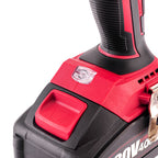 Close-up of a cordless drill battery showing the red and black switch, textured grip, and part of the battery label on a white background.