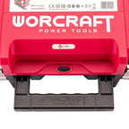 Close-up of a red and black WORCRAFT Power Tools tool case or accessory housing, showing the brand name in large white letters, a small CUBE badge, and a black handle with WORCRAFT embossed on it.