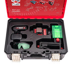 An open red and black XCUBE laser level kit case on a white background, showing included accessories such as a red laser level battery pack, green-tinted eyewear, a target plate, and other tools in a molded black tray.
