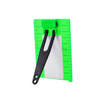 A bright green plastic measuring tool with black plastic clips and a white rectangular insert, shown on a plain white background.